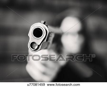 Man with handgun pointing towards camera View Large Photo Image Stock Photo - Man with handgun pointing towards camera. Fotosearch