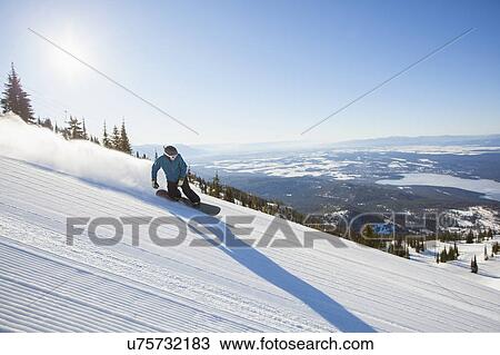Mature man on ski slope at sunlight View Large Photo Image Stock Image - Mature man on ski slope at sunlight. Fotosearch