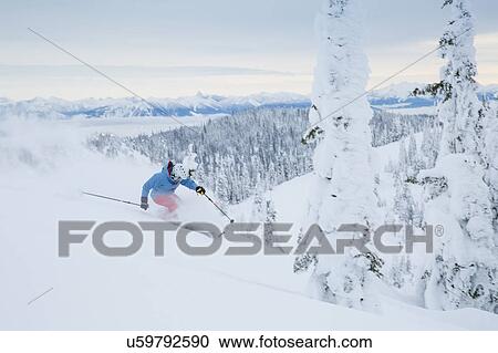 Mature man speeding on ski slope View Large Photo Image Stock Image - Mature man speeding on ski slope. Fotosearch