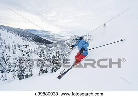 Mature man speeding on ski slope View Large Photo Image Stock Photo - Mature man speeding on ski slope. Fotosearch