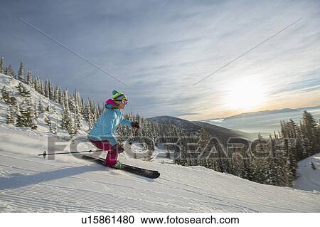 Mature woman on ski slope at sunset View Large Photo Image Stock Image - Mature woman on ski slope at sunset. Fotosearch