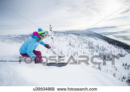 Mature woman speeding on ski slope View Large Photo Image Stock Photo - Mature woman speeding on ski slope. Fotosearch