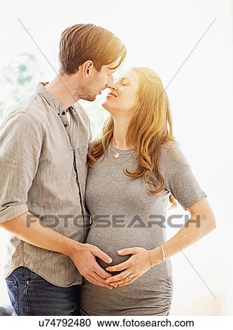 Mid-adult couple kissing outdoors View Large Photo Image Stock Image - Mid-adult couple kissing outdoors. Fotosearch