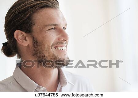 Stock Photography - Mid-adult man laughing. Fotosearch