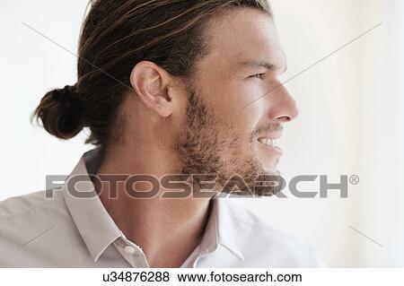 Mid-adult man looking away View Large Photo Image Stock Photo - Mid-adult man looking away. Fotosearch