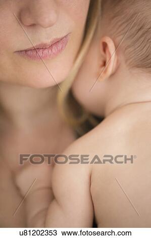 Mother consoling baby girl (2-5 months) View Large Photo Image Stock Image - Mother consoling baby girl (2-5 months). Fotosearch