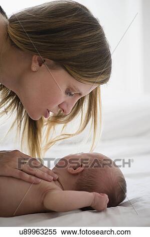 Mother consoling baby girl (2-5 months) View Large Photo Image Stock Photography - Mother consoling baby girl (2-5 months). Fotosearch