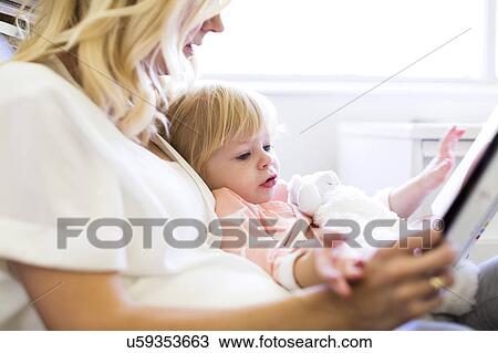 Mother reading book with daughter (2-3) View Large Photo Image Stock Image - Mother reading book with daughter (2-3). Fotosearch