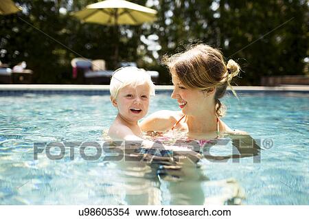 Mother with son (2-3) in swimming pool View Large Photo Image Picture - Mother with son (2-3) in swimming pool. Fotosearch