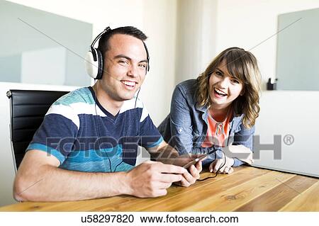Office workers smiling View Large Photo Image Stock Image - Office workers smiling. Fotosearch