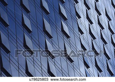 Stock Image - Open windows on glass building. Fotosearch