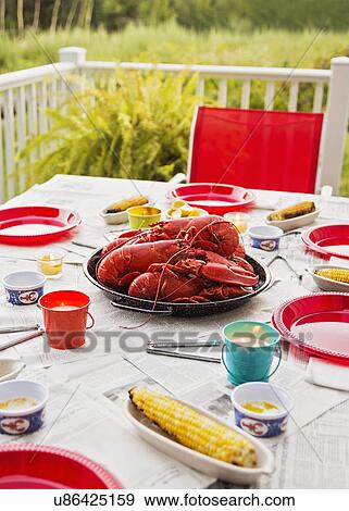 Plate with lobsters on dining table View Large Photo Image Stock Photo - Plate with lobsters on dining table. Fotosearch