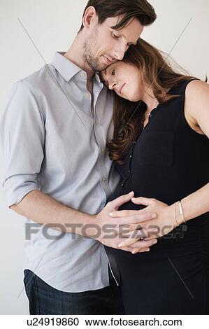 Portrait of content couple holding hands View Large Photo Image Stock Image - Portrait of content couple holding hands. Fotosearch