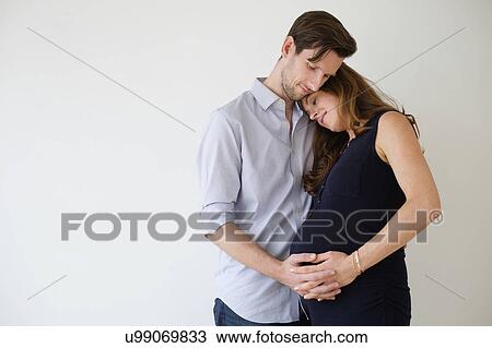 Portrait of content couple holding hands View Large Photo Image Stock Image - Portrait of content couple holding hands. Fotosearch