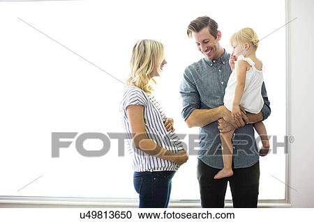 Stock Image - Portrait of family with daughter (2-3). Fotosearch