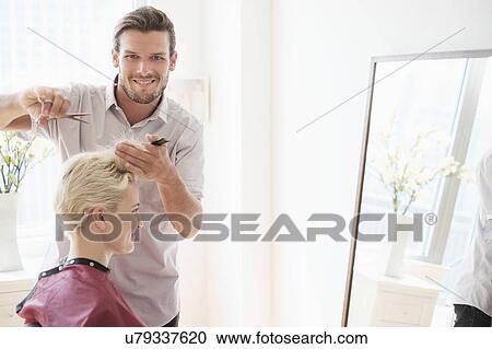 Portrait of hairdresser cutting woman's hair View Large Photo Image Stock Image - Portrait of hairdresser cutting woman's hair. Fotosearch