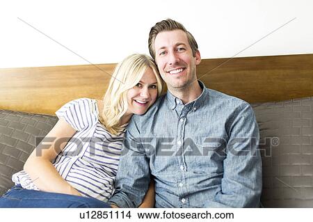 Picture - Portrait of mid adult couple at home. Fotosearch