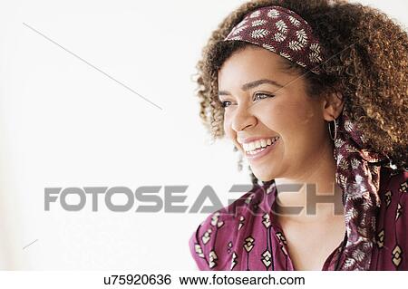 Portrait of smiling woman with curly hair View Large Photo Image Stock Photograph - Portrait of smiling woman with curly hair. Fotosearch