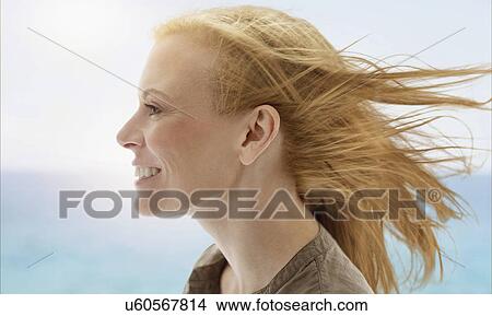 Portrait of woman by sea View Large Photo Image Picture - Portrait of woman by sea. Fotosearch