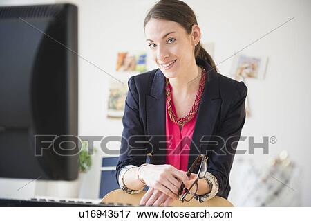 Portrait of woman in office View Large Photo Image Stock Photo - Portrait of woman in office. Fotosearch