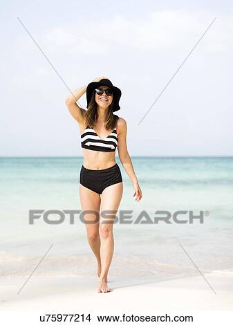 Picture - Portrait of woman on beach. Fotosearch