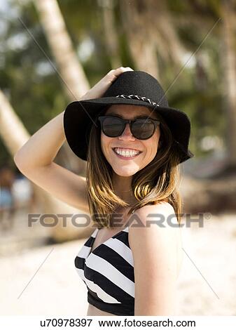 Portrait of woman smiling on beach View Large Photo Image Stock Photo - Portrait of woman smiling on beach. Fotosearch