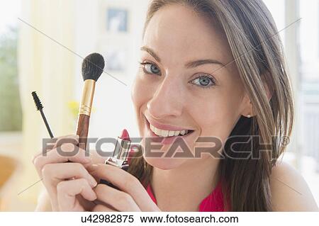Portrait of woman with make up utensils View Large Photo Image Stock Photography - Portrait of woman with make up utensils. Fotosearch