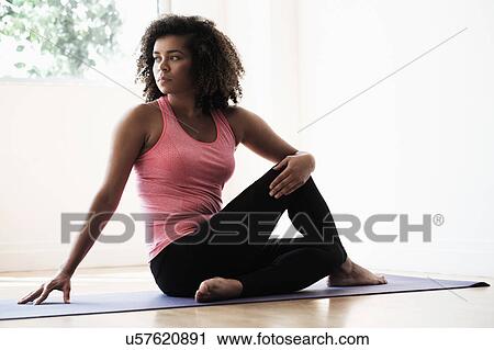 Portrait of young woman at gym View Large Photo Image Stock Image - Portrait of young woman at gym. Fotosearch