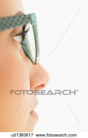 Stock Photo - Portrait of young woman in studio. Fotosearch