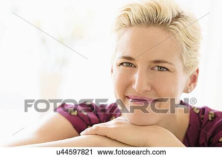 Portrait of young woman indoors View Large Photo Image Stock Image - Portrait of young woman indoors. Fotosearch
