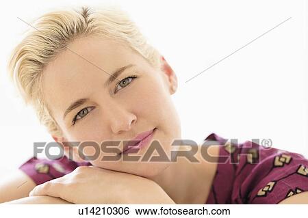 Portrait of young woman on white background View Large Photo Image Stock Photograph - Portrait of young woman on white background. Fotosearch