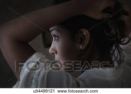 Stock Image - Portrait of young woman. Fotosearch