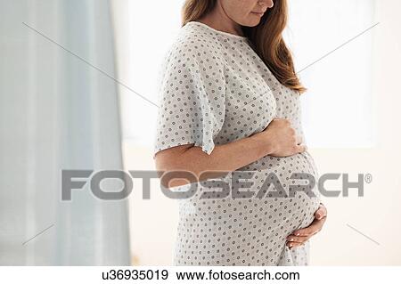 Pregnant woman at hospital View Large Photo Image Stock Photo - Pregnant woman at hospital. Fotosearch