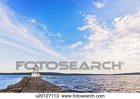 Stock Image - Rockland Breakwater Lighthouse seeing from pier. Fotosearch