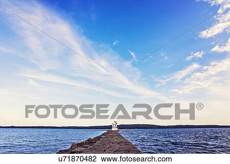 Stock Image - Rockland Breakwater Lighthouse seeing from pier. Fotosearch