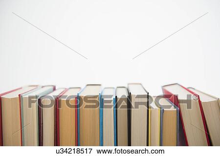Stock Photo - Row of books on white background. Fotosearch