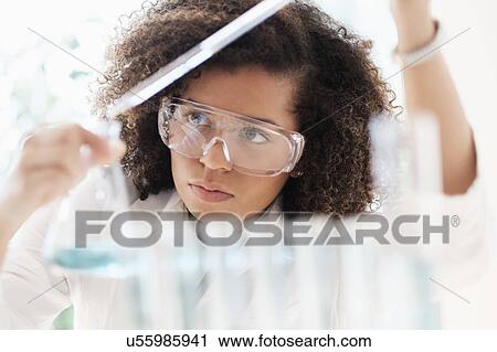 Stock Image - Scientist doing chemical research. Fotosearch