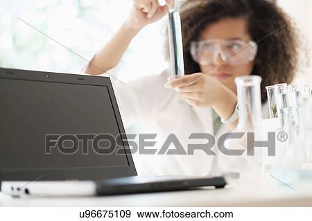 Stock Photo - Scientist doing chemical research. Fotosearch