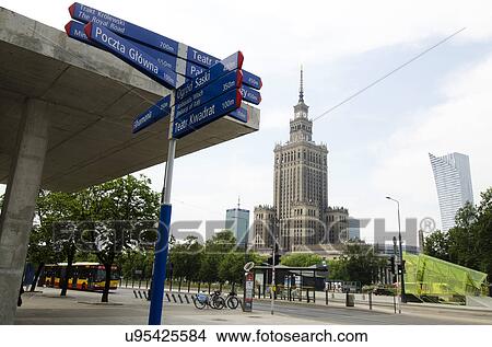 Picture - Sign post with Palace of Culture and Science in background. Fotosearch
