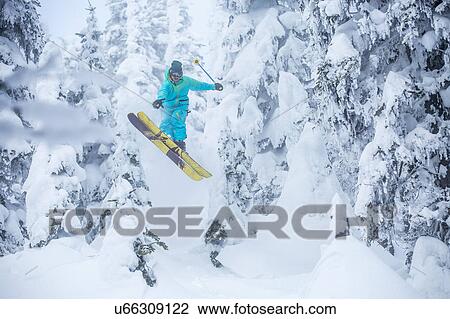 Skier jumping in forest View Large Photo Image Stock Image - Skier jumping in forest. Fotosearch