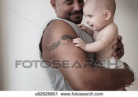 Studio shot of baby girl (2-5 months) with her father View Large Photo Image Stock Image - Studio shot of baby girl (2-5 months) with her father. Fotosearch