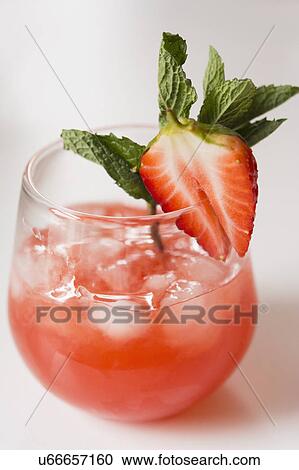 Stock Image - Studio shot of strawberry drink. Fotosearch