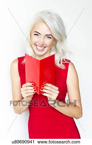 Studio shot of woman wearing red dress View Large Photo Image Stock Image - Studio shot of woman wearing red dress. Fotosearch