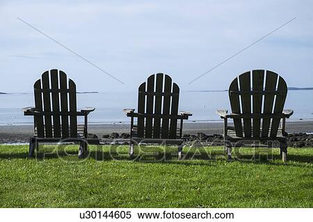 Three adirondack style chairs View Large Photo Image Stock Photography - Three adirondack style chairs. Fotosearch