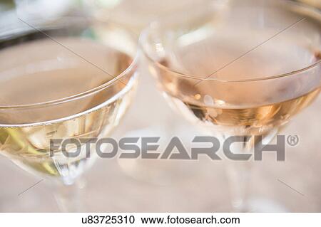 Two white wine glasses View Large Photo Image Stock Image - Two white wine glasses. Fotosearch
