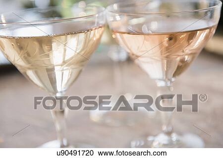Stock Image - Two white wine glasses. Fotosearch