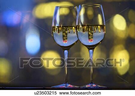 Two wineglasses with white wine View Large Photo Image Stock Photography - Two wineglasses with white wine. Fotosearch