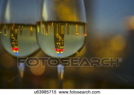 Stock Photography - Two wineglasses with white wine. Fotosearch