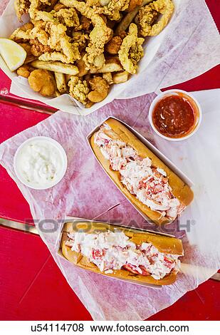 Stock Photo - View of lobster meal on red. Fotosearch