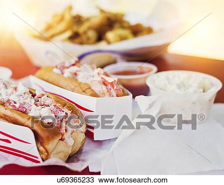 Stock Image - View of lobster sandwiches and salad. Fotosearch